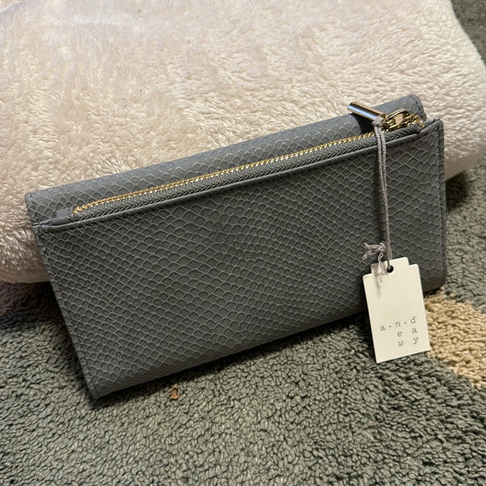 A New Day Women’s button zip wallet. New with Tags. Grey gray